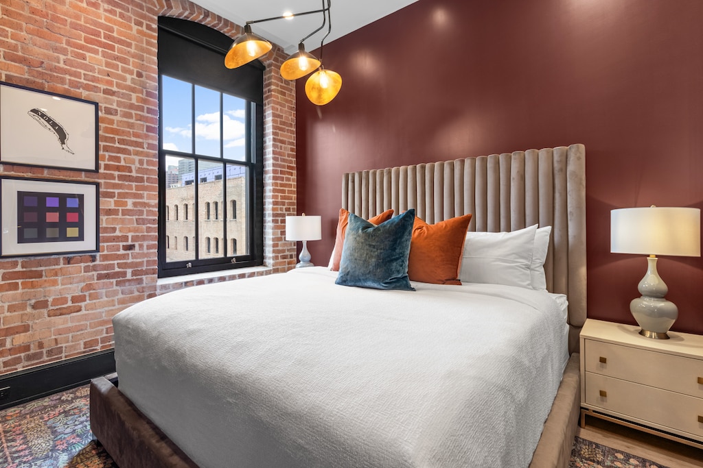 Retreat to the primary bedroom with a plush king bed, walk-in closet, blackout shades, and a smart TV. Designed for comfort and privacy, this suite is perfect for recharging after a day exploring New Orleans.