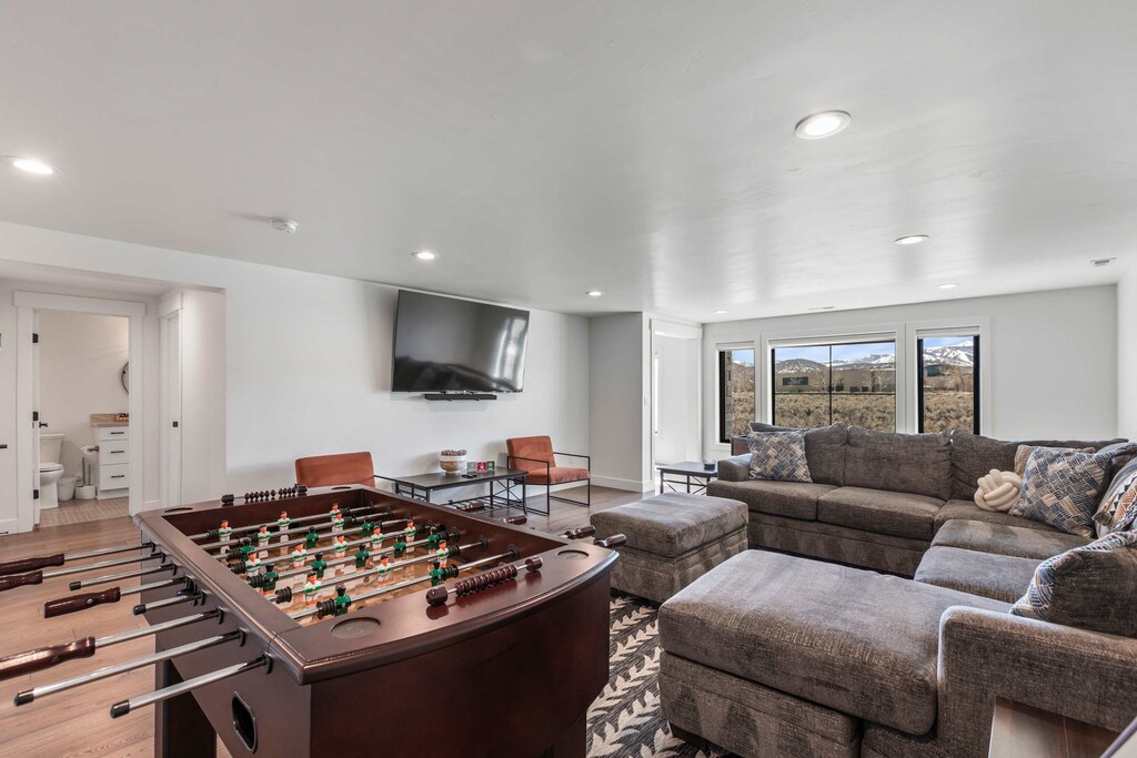 What a great game room. Enjoy Foosball, Shuffle board of just hanging out watching a movie with friends. 