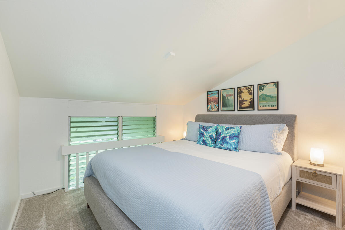Tucked-away loft bedroom with Cal King bed—ideal for restful nights or a cozy read.