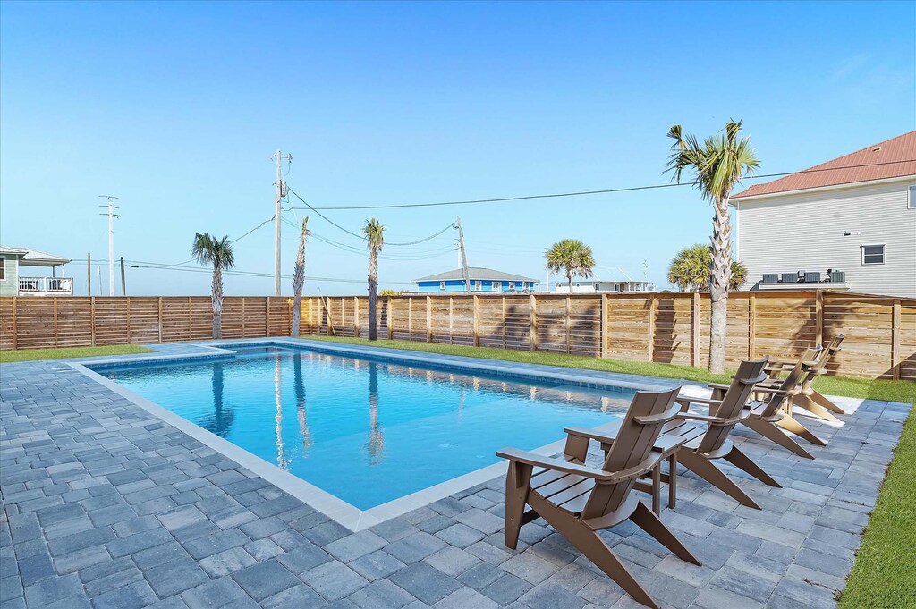 Fenced-in back yard with private pool