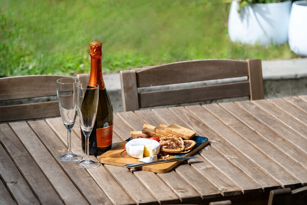 A small backyard with great potential! With just a table and chairs, you can create a peaceful space for relaxation or entertaining.