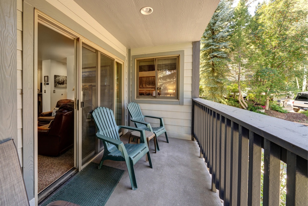 The private balcony has large sliding glass doors and seating to take in the view.