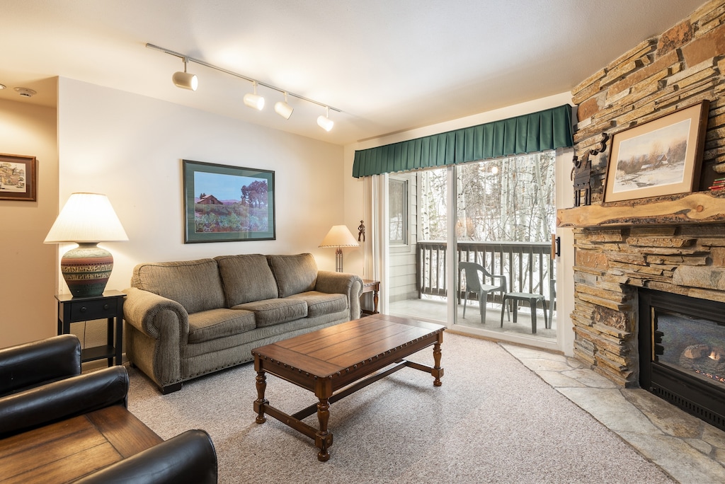 Living room overlooking aspen forest