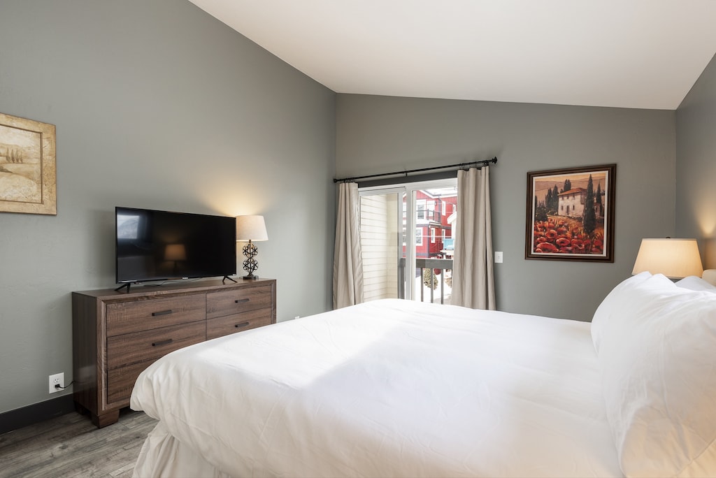 Main bedroom with adjacent patio