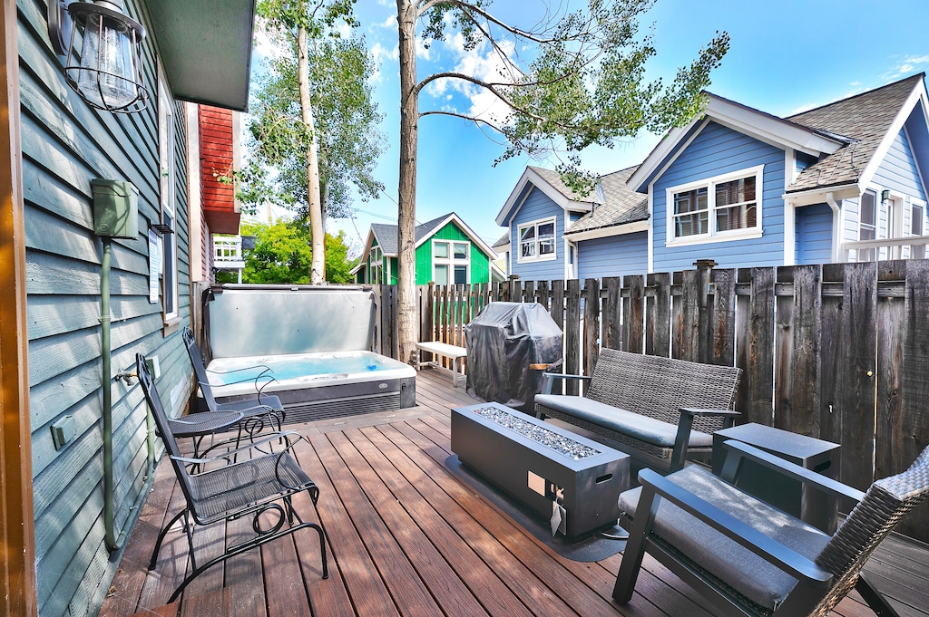 Your patio sanctuary right in the heart of old town, wooden deck with wooden privacy fence, hot tub and patio seating