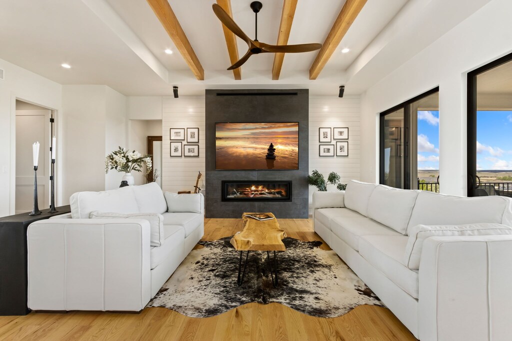 Living Room with Vaulted Ceilings, Indoor Fireplace, and Smart TV (main level)