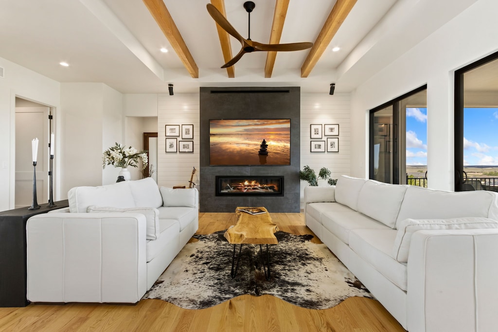Living Room with Vaulted Ceilings, Indoor Fireplace, and Smart TV (main level)