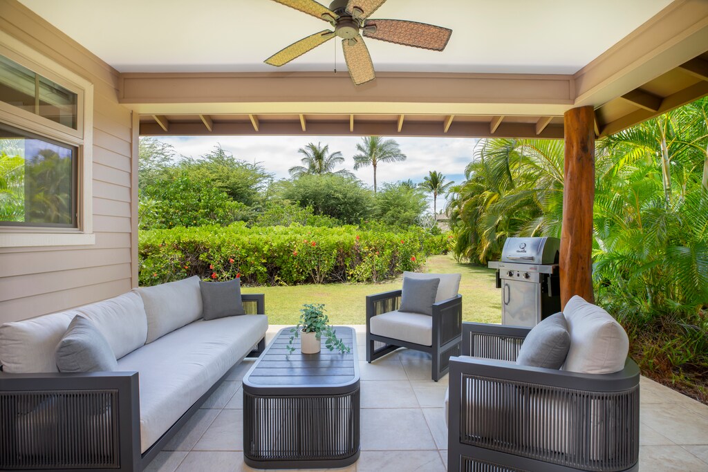 Unwind on the private lanai, the perfect spot for morning coffee or sunset cocktails amid lush tropical landscaping.
