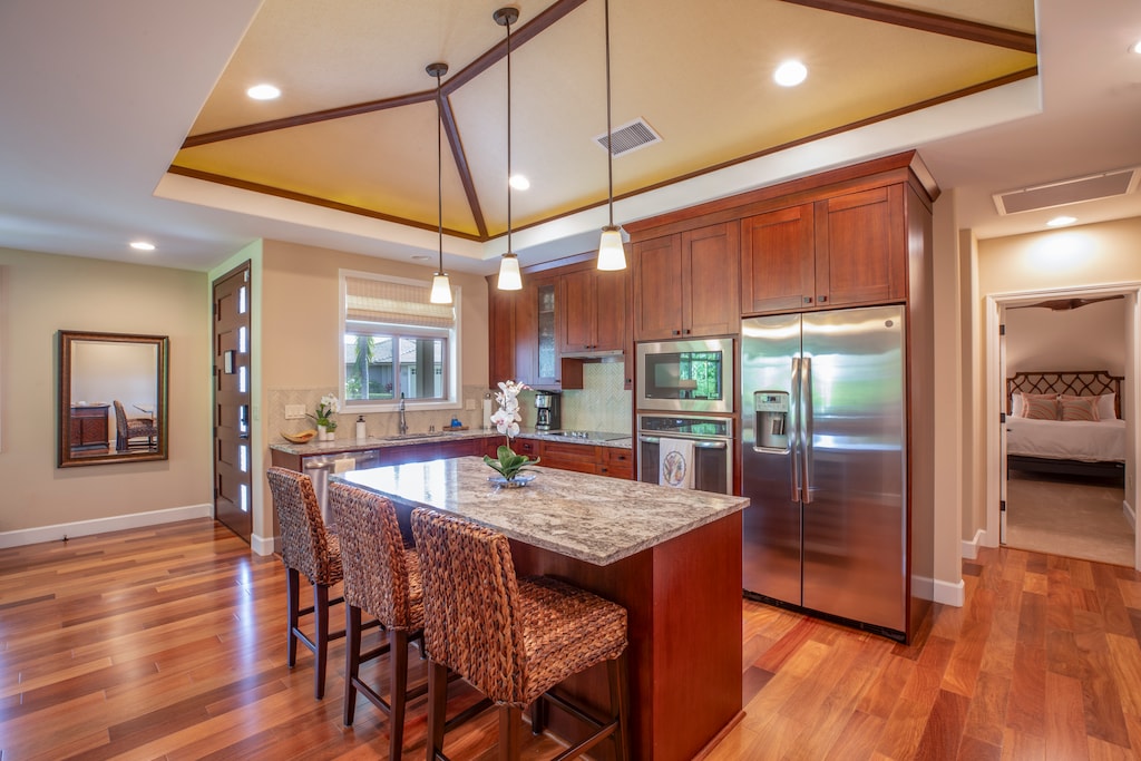 Cook like a pro in the chef-inspired kitchen with stainless steel appliances, granite countertops, and a spacious island.