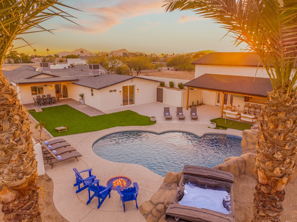Watch the sunset paint the sky while you relax by your private pool surrounded by desert palms