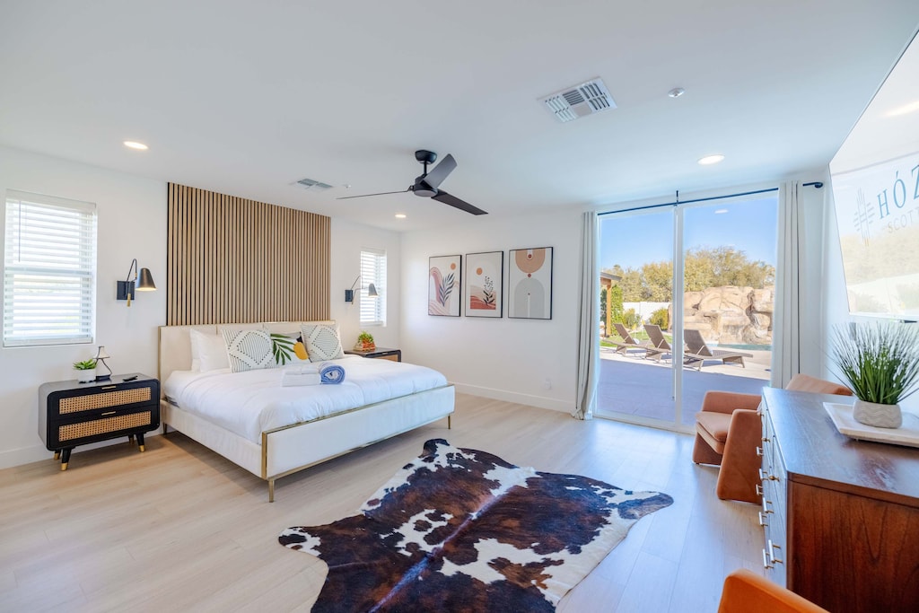 Wake up in this bright primary suite with desert views and your own cowhide rug