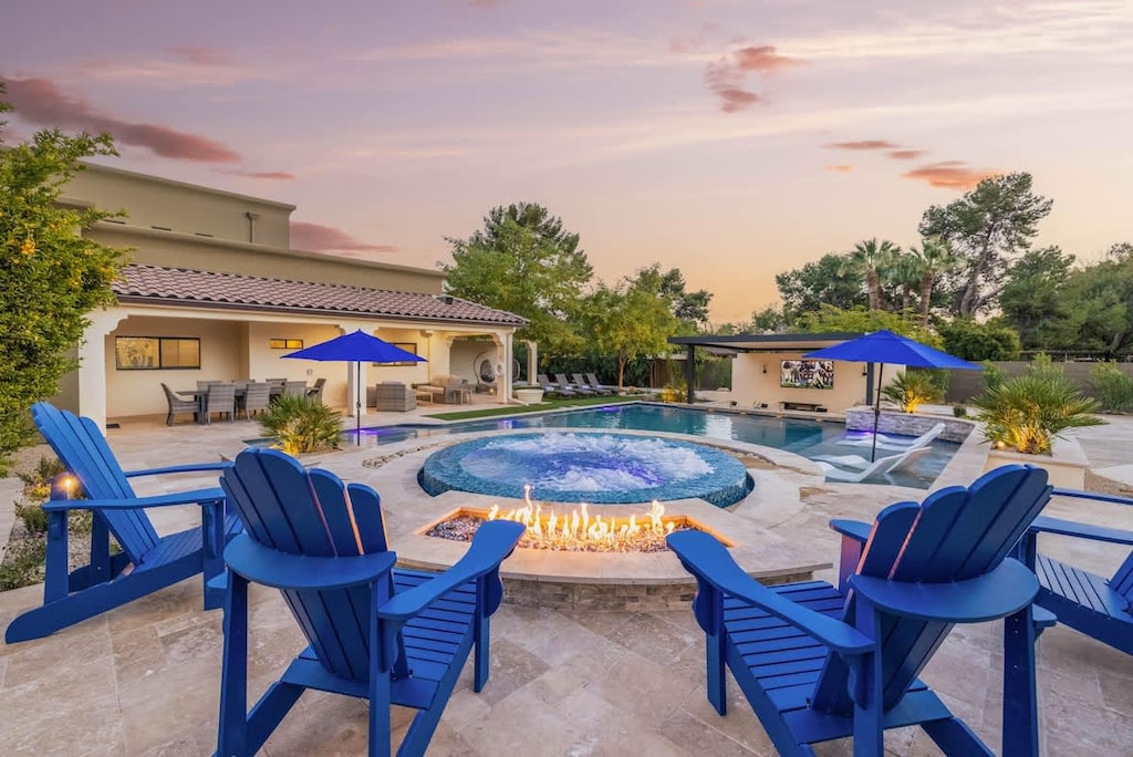 Ignite your evenings: fire, water, and desert serenity combined.