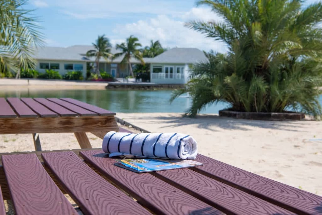 Summertime Suites lake and seating area near the lake