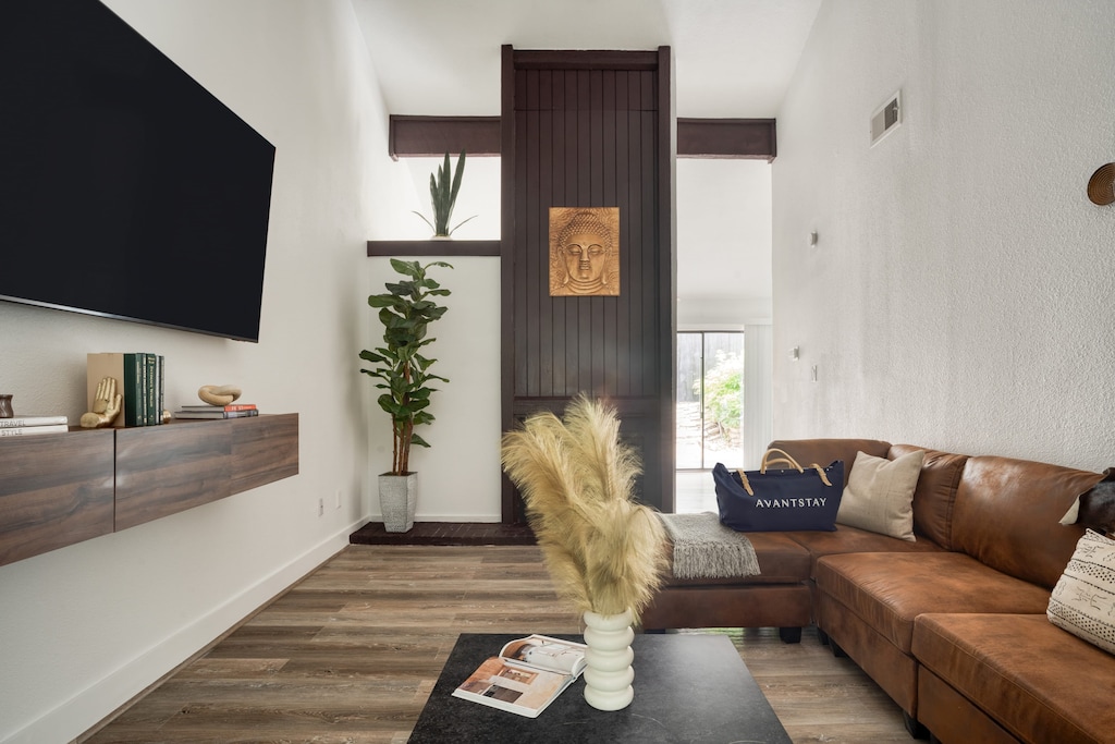 Unit A: Living Room features a fireplace and a TV.