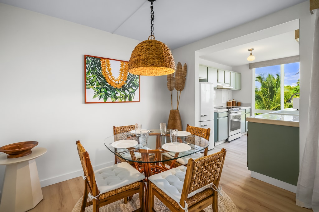 Gather your loved ones in our inviting dining room, where comfort meets island charm.