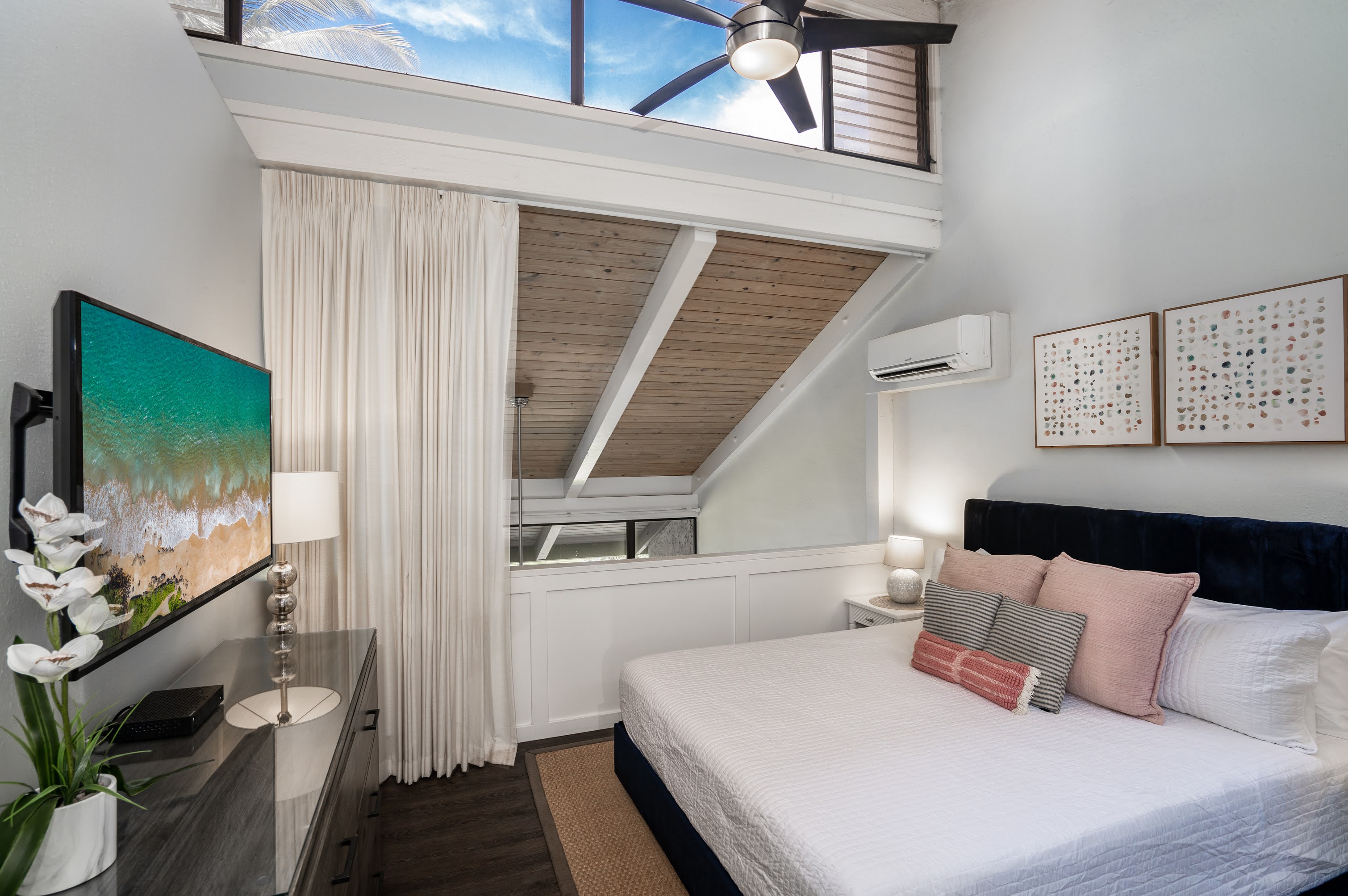 Primary bedroom features a king bed