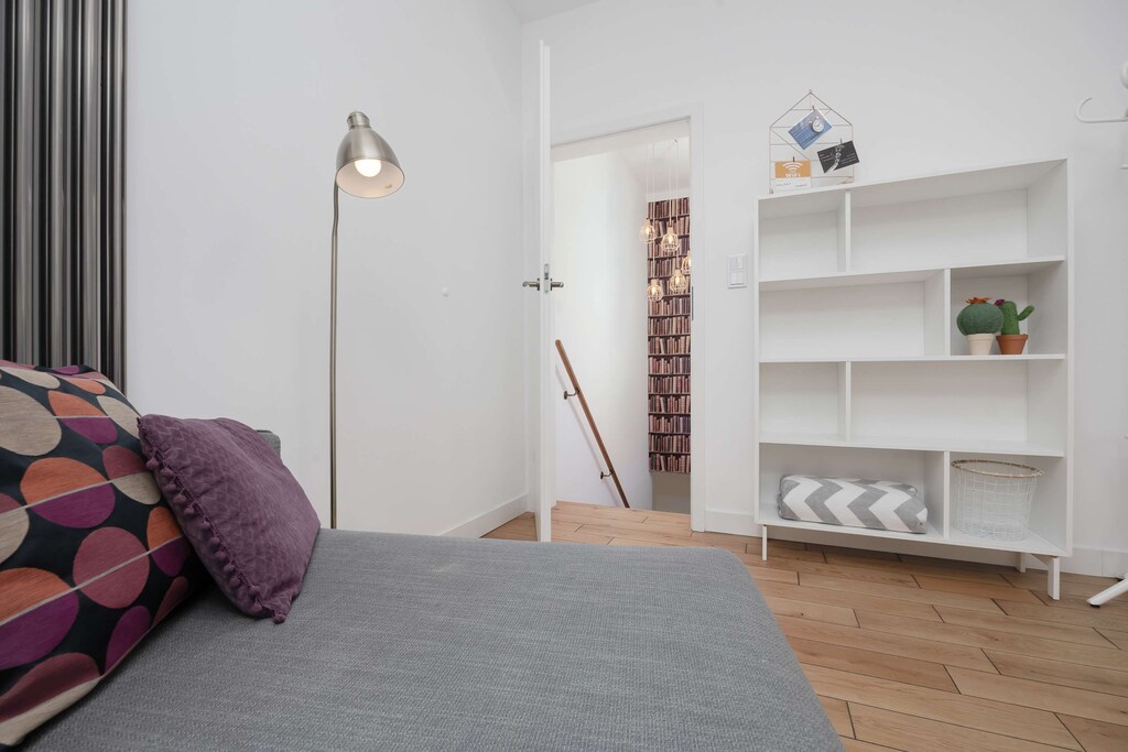  A cozy lounge area with a soft sofa, stylish accents, and natural light.