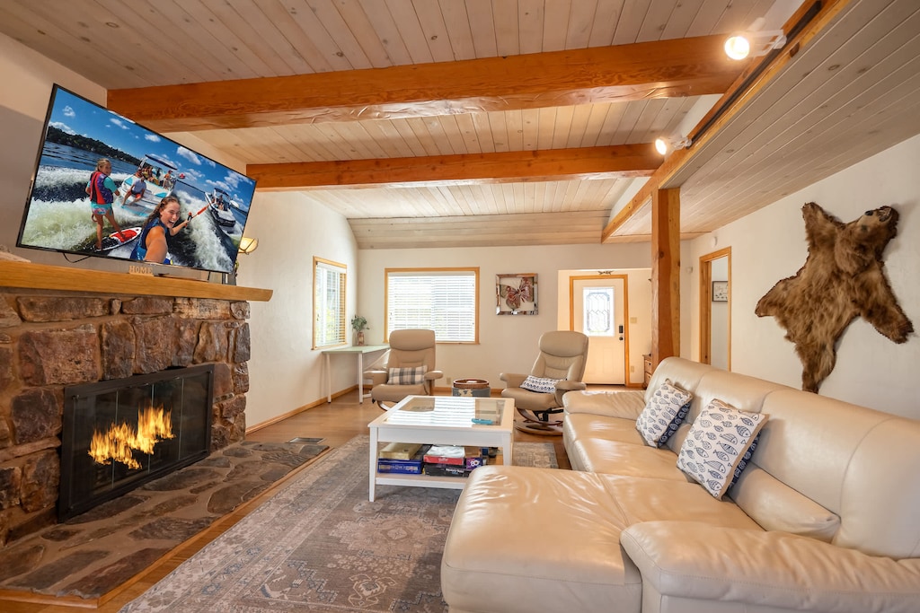 Huge 65" Roku TV. Stream your favorite channels. Plenty of seating. Flip the wall switch for instant lit fireplace.