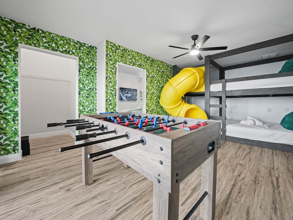 Sleep, slide, play, repeat! Our queen-sized bunk bed with a slide turns bedtime into an adventure — and yes, there’s a foosball table too!