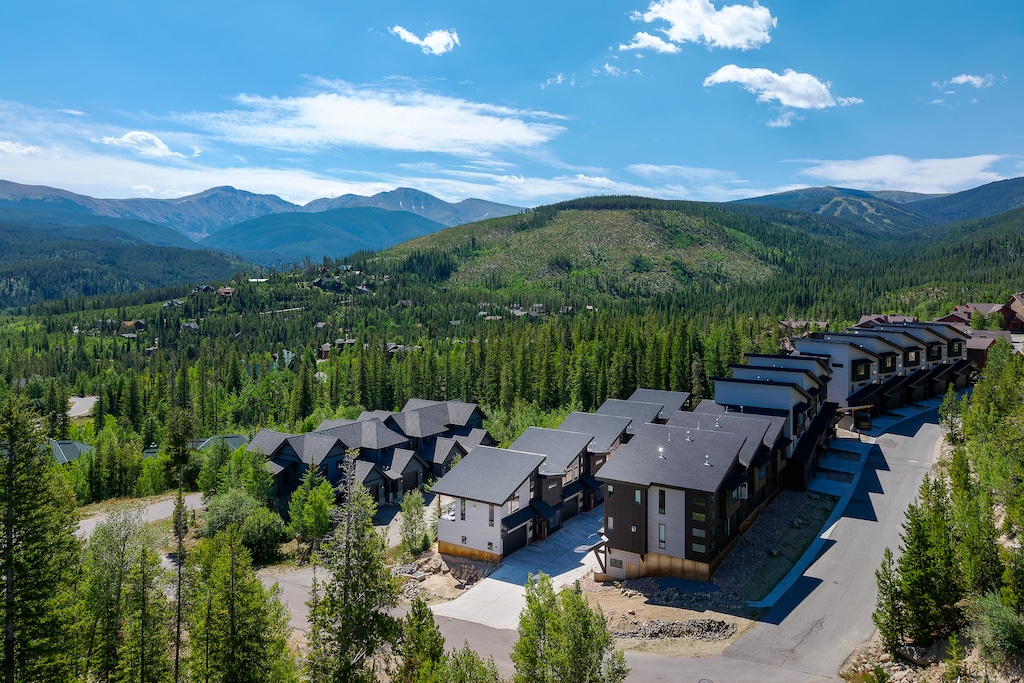 - Community of modern homes with mountain views   - Surrounded by pine trees and alpine scenery   - Easy access to trails, skiing, and outdoor fun