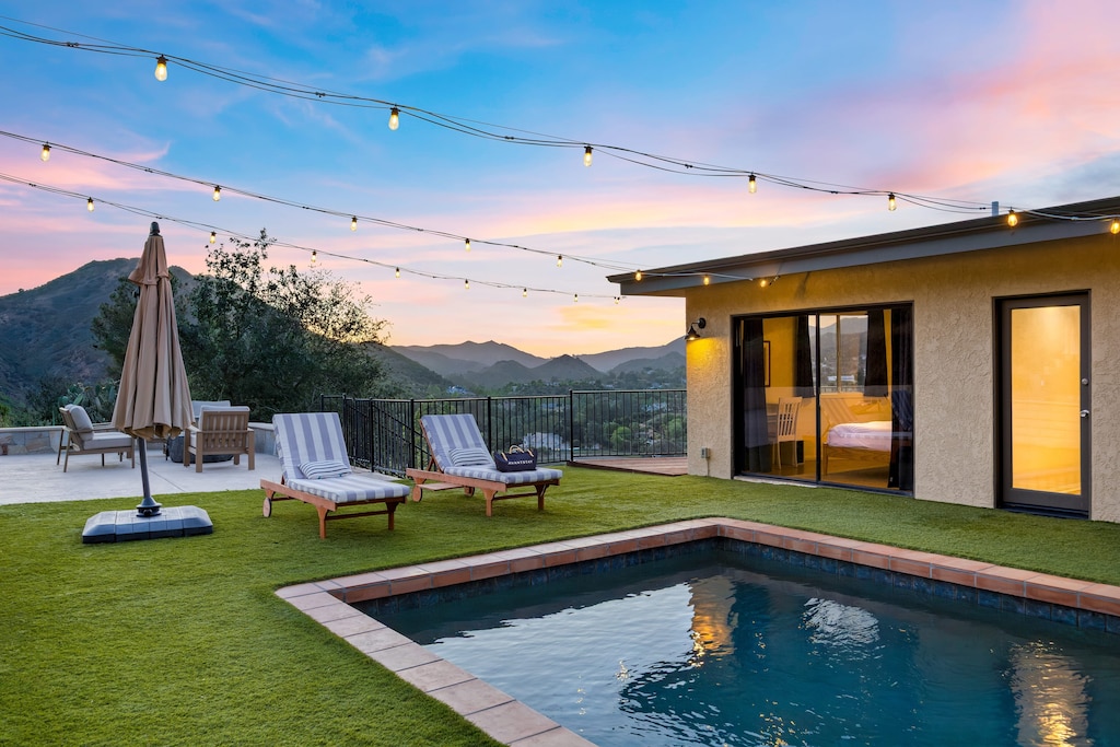 Twilight conversation nook under string lights.