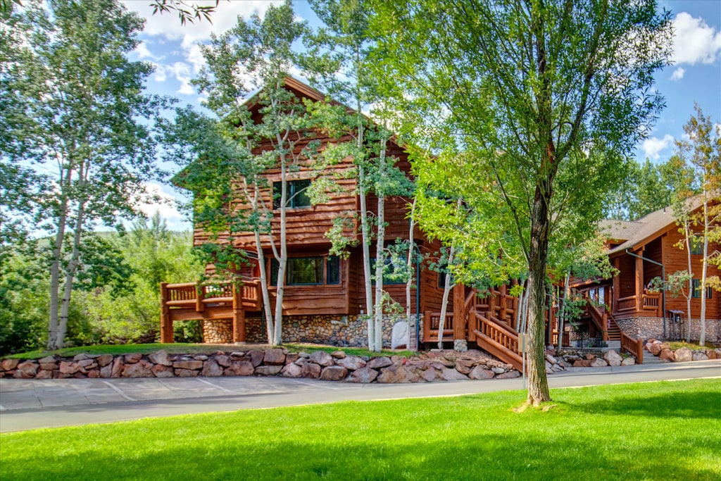 Timber Wolf Lodge 7C is surrounded by plants, trees and a babbling creek nearby.