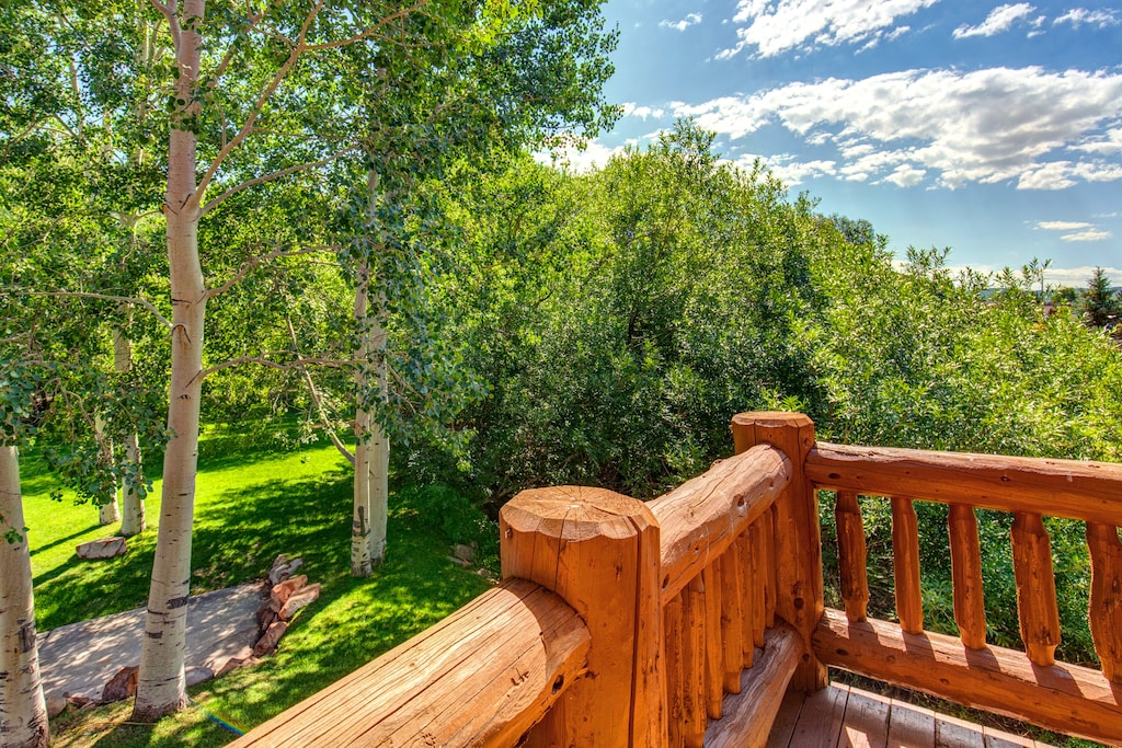 The private balcony with a relaxing view of the trees and you can hear the babbling creek.
