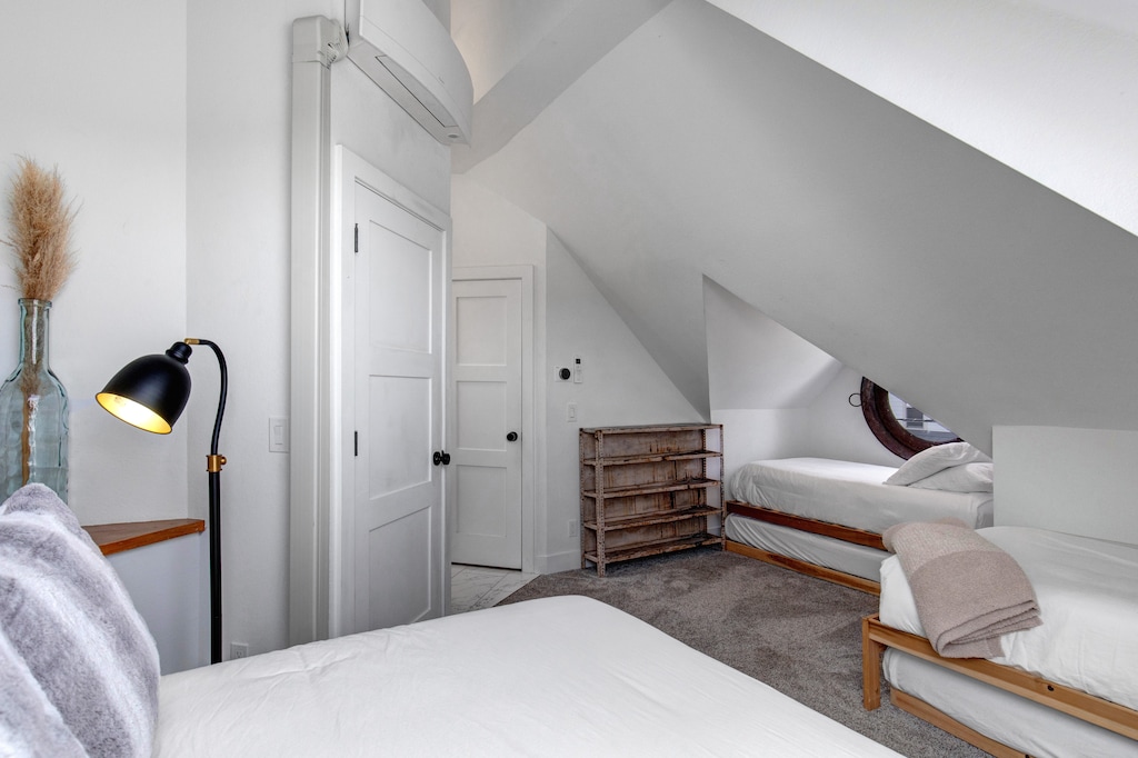 The second bedroom with a queen size bed and two twin beds with twin trundles.