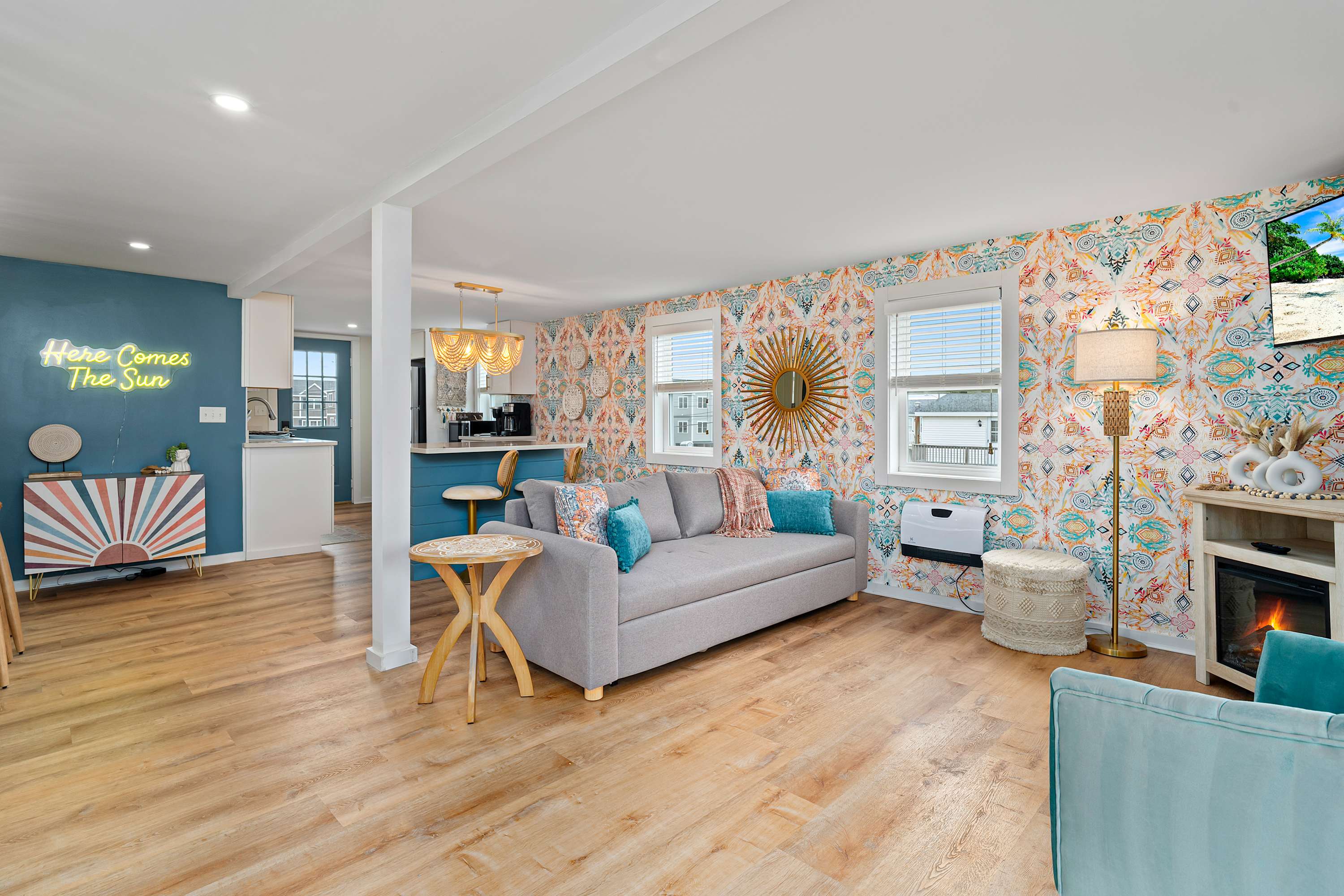 Open, living room, kitchen & dining room with "here comes the sun" neon light sign, flat screen smart TV & sleeper sofa. Private front covered deck with seating, back private deck with picnic table, yoga mats, dining table for 6 pp & island for 2pp Open, living room, kitchen & dining room with "here comes the sun" neon light sign, flat screen smart TV & sleeper sofa. Private front covered deck with seating, back private deck with picnic table, yoga mats, dining table for 6 pp & island for 2pp