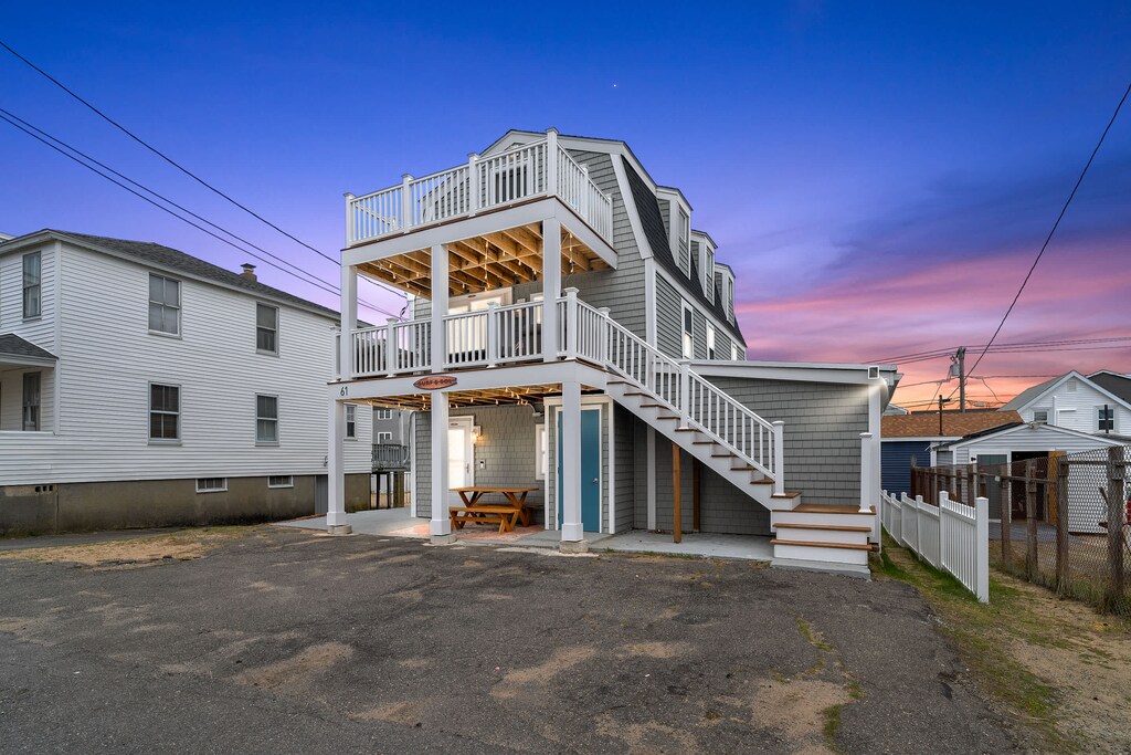Exterior of property. This unit is located on the ground level, and comes with 2 off-street parking spots (parked side-by-side on the left-hand side of the driveway)