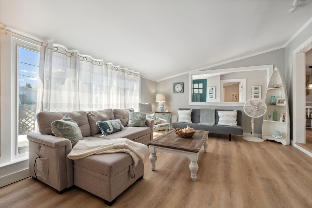 Spacious living room with sectional pull out sofa and 3-seater sofa. Note: fireplace is inoperable