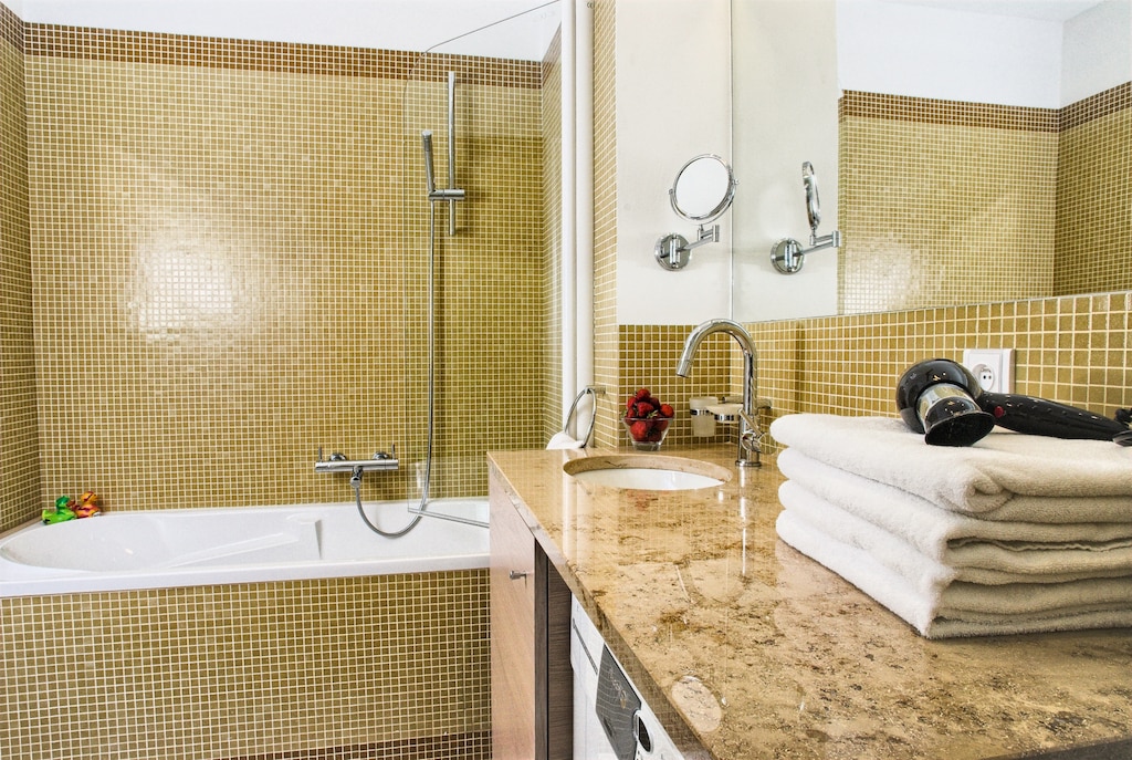 Master bathroom with bathtub