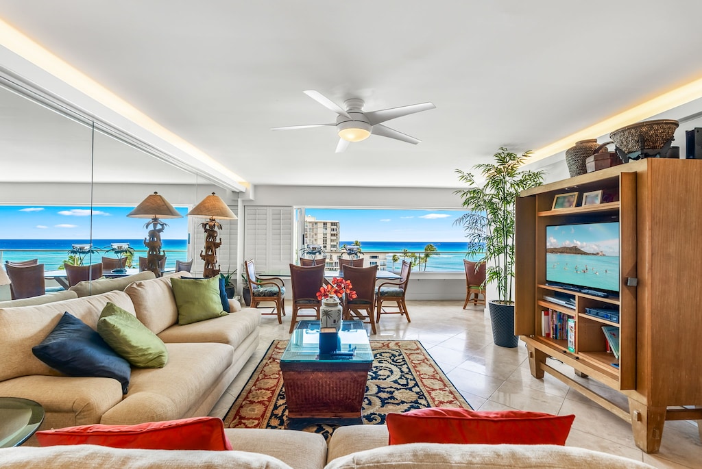 Full-length sliding windows invite ocean breezes and glowing sunsets into your living space—creating an unforgettable backdrop to every stay.