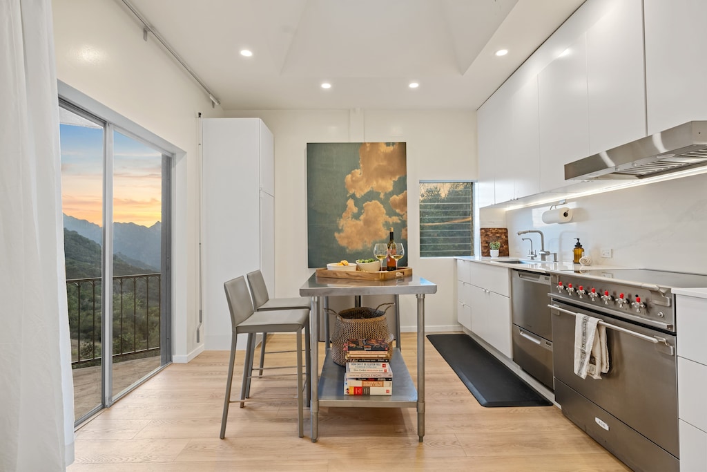 Sleek kitchen with stainless steel appliances.