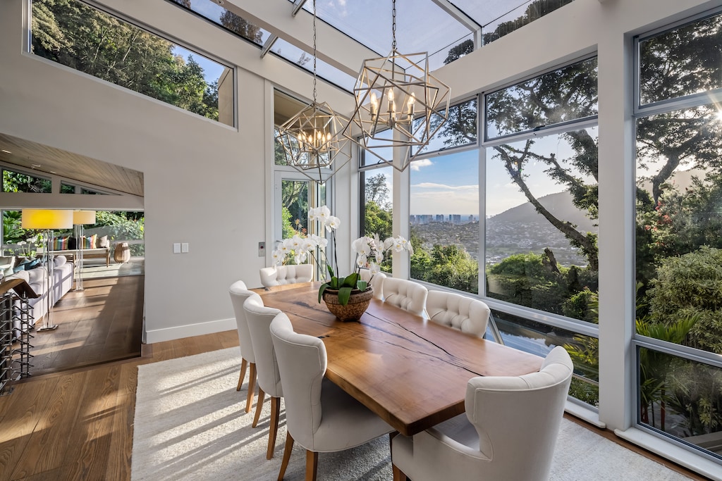 Elegant dining room with vaulted glass ceiling and mountain-to-sea views—ideal for memorable meals together.