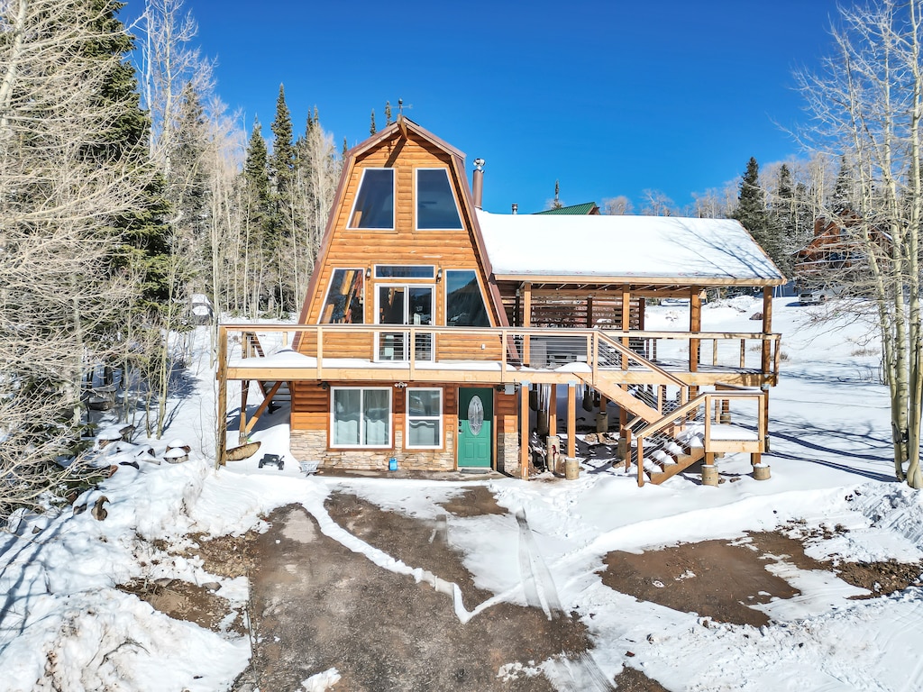 Exterior: Enjoy stunning mountain views from this charming A-frame cabin