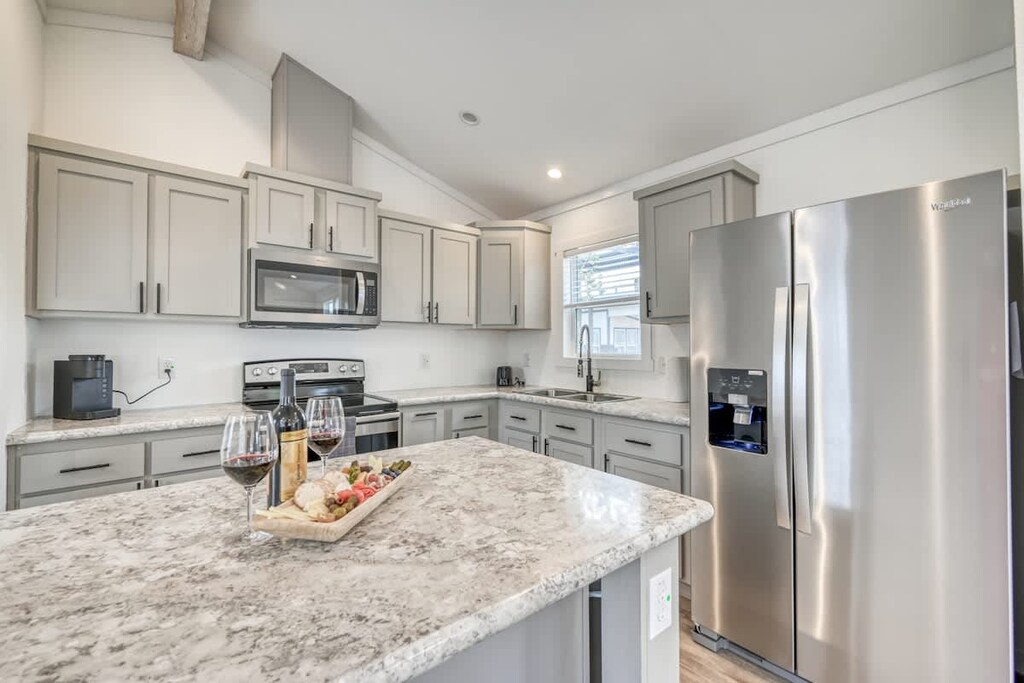 Enjoy a full kitchen and a large center island with your rental during your stay!