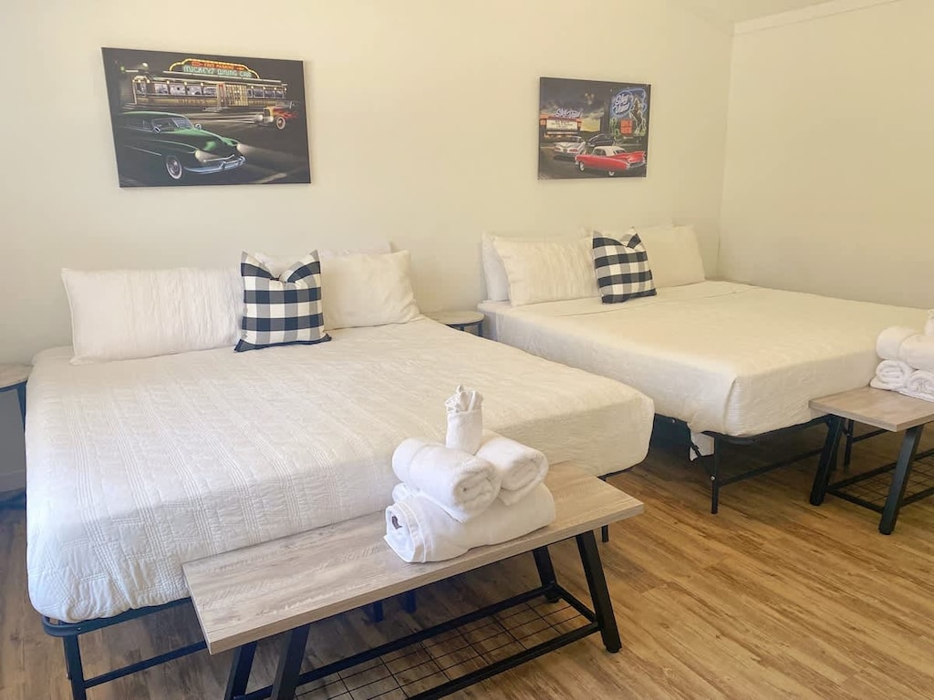 The bedroom features two king size beds.