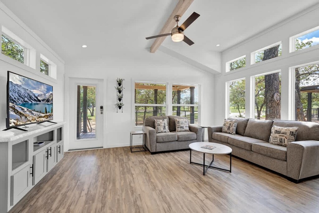 The tiny home's clever design and ample windows create a bright and airy living space, making it feel much larger than its compact footprint.