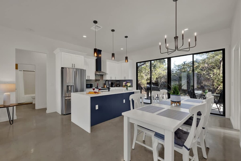 The kitchen features stainless steel appliances and plenty of counter space.