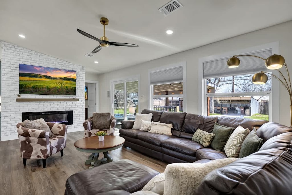 Spacious and bright living room with cozy seating for all.