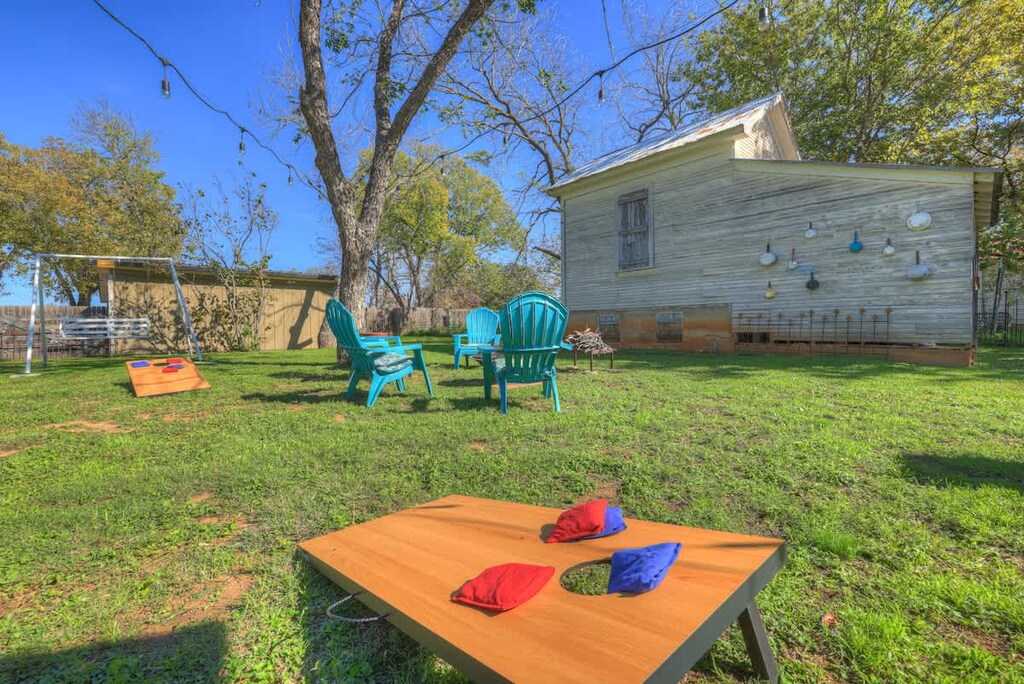 Play a game of cornhole with friends and family.