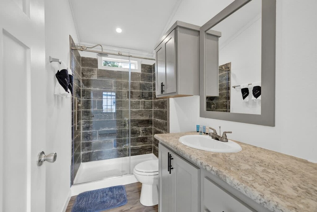 The spacious walk-in shower is a haven of relaxation, offering ample room to unwind and rejuvenate under a cascading flow of water.