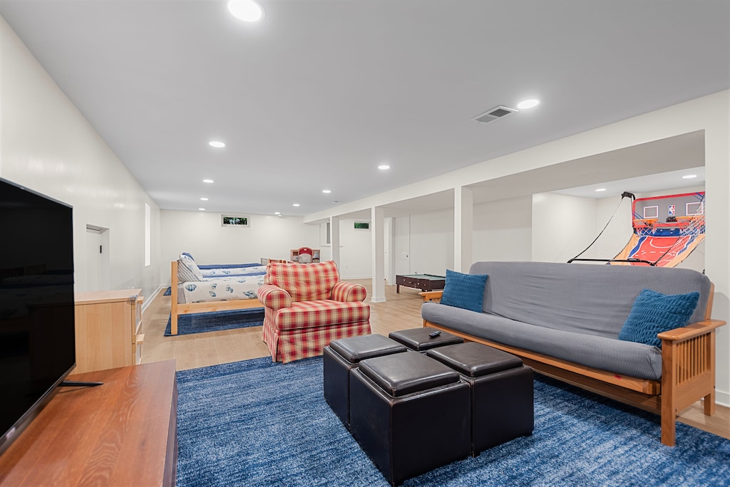 Family hangout space with games, TV & comfy seating.