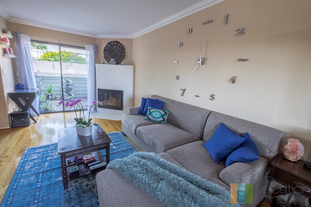 Main floor living room with TV and patio access.. Main floor living room with TV and patio access.