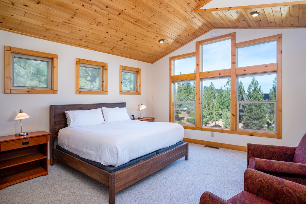 This spacious, private room offers a king bed with lush bedding, lounge chairs and a floor to ceiling windows and direct access to the upper open deck with incredible views!