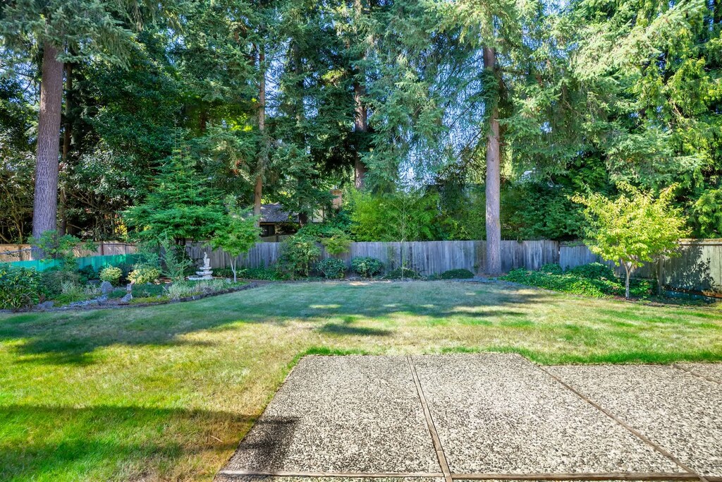 Let the kids run free, the dog chase butterflies, and the stress melt away—this fenced yard was made for real-life moments