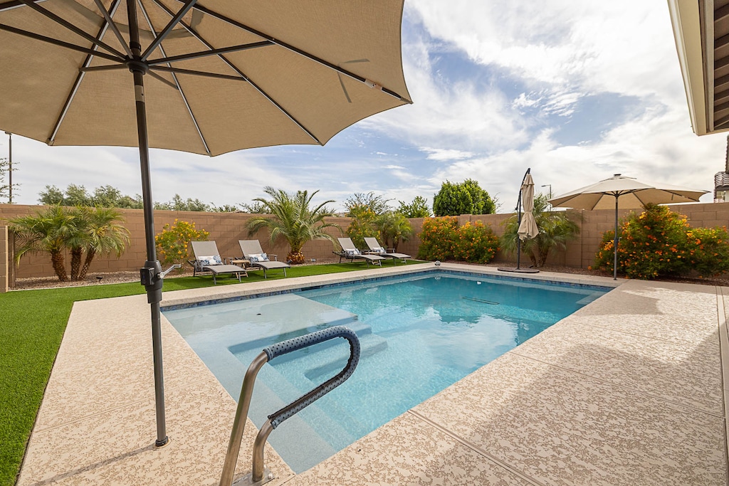 Heated pool with grab bar