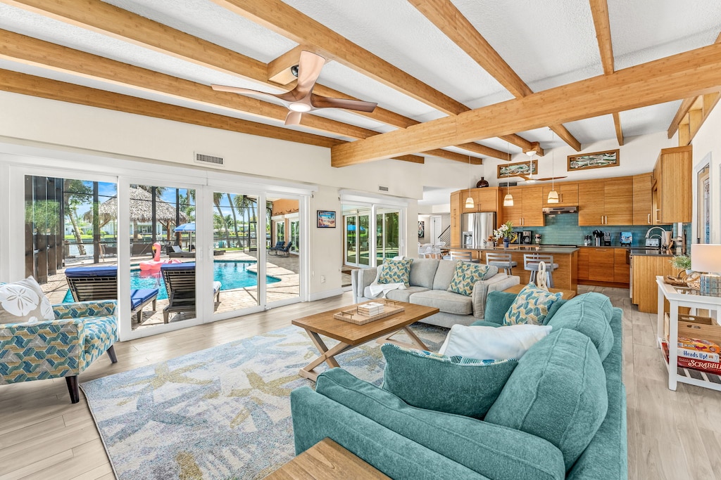 Large open living space with beautiful poolside views.