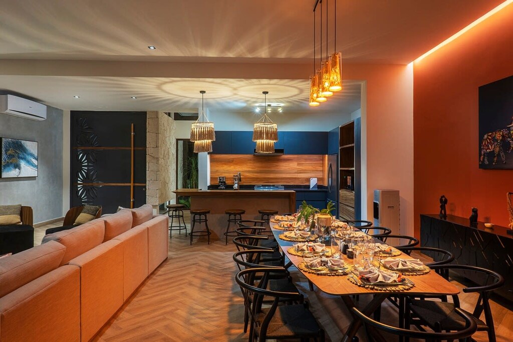 Open concept kitchen, dining room, and living room. Located on the first floor. Unique and modern design. It features AC.